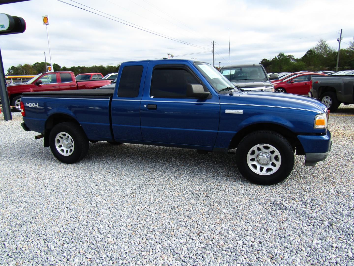 2010 Blue /Black Ford Ranger Sport SuperCab 4-Door 4WD (1FTLR4FE6AP) with an 4.0L V6 SOHC 12V engine, Automatic transmission, located at 15016 S Hwy 231, Midland City, AL, 36350, (334) 983-3001, 31.306210, -85.495277 - Photo#0